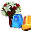 Mazzo di lilium rose rosse e pandoro